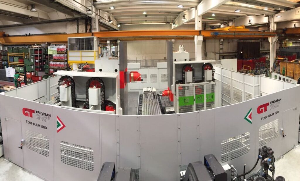 A double column machine with a long table in between two RAM spindles made by Trevisan