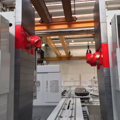 IMG-20170525-WA0000 A double column machine with two, red RAM spindles in a warehouse
